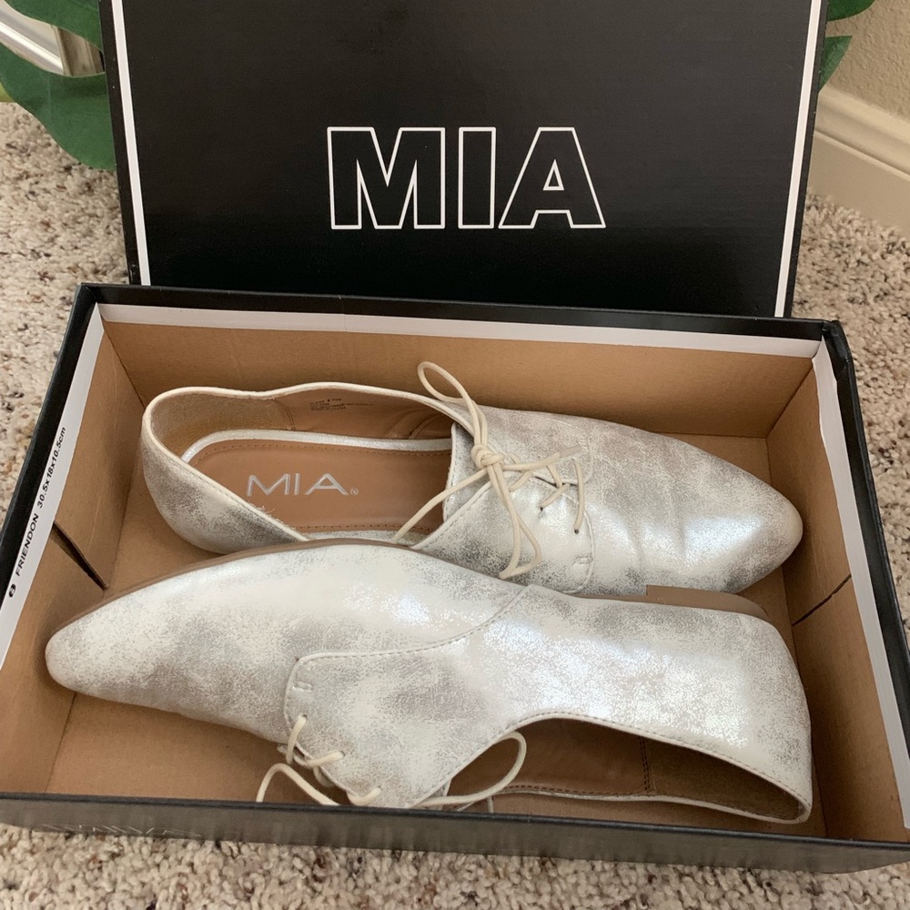 Silver oxford-style shoes